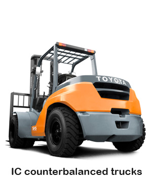 Industrial forklift lifting or moving pallets inside a warehouse